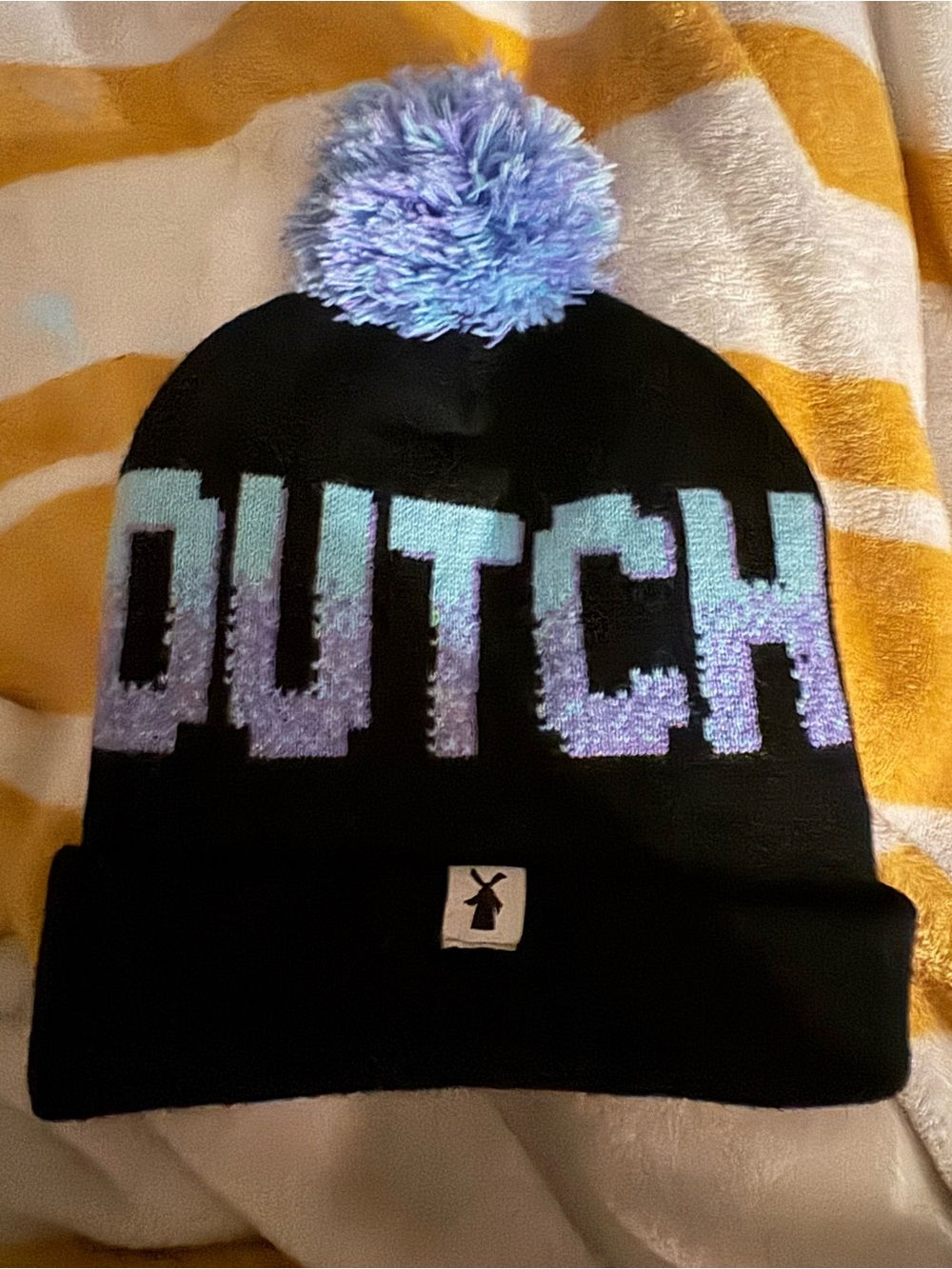 Dutch Bros Black Beanie with Lavender and Aqua Pom Pom